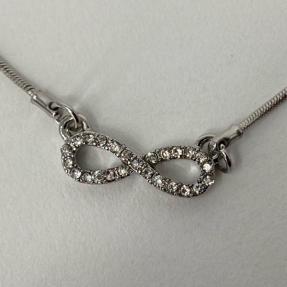 Graziano Silver Tone Infinity Charm encrusted with crystals 16” - 19” long chain